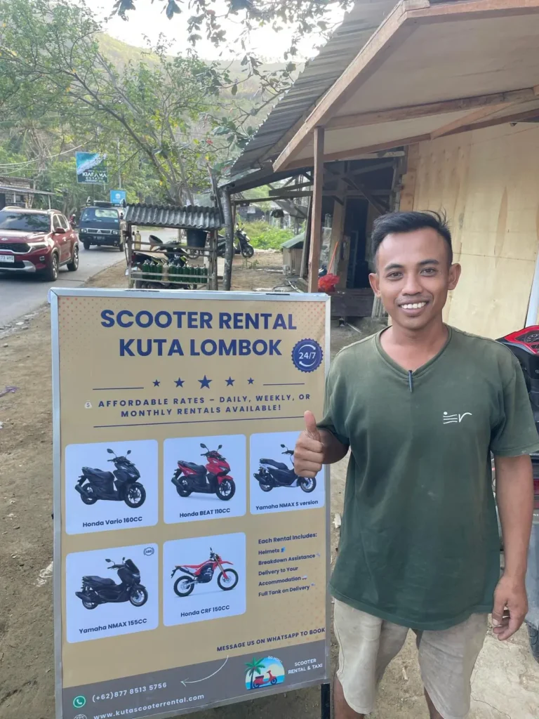 The owner of Go MOH in front of the shop